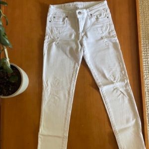 Distressed white jeans